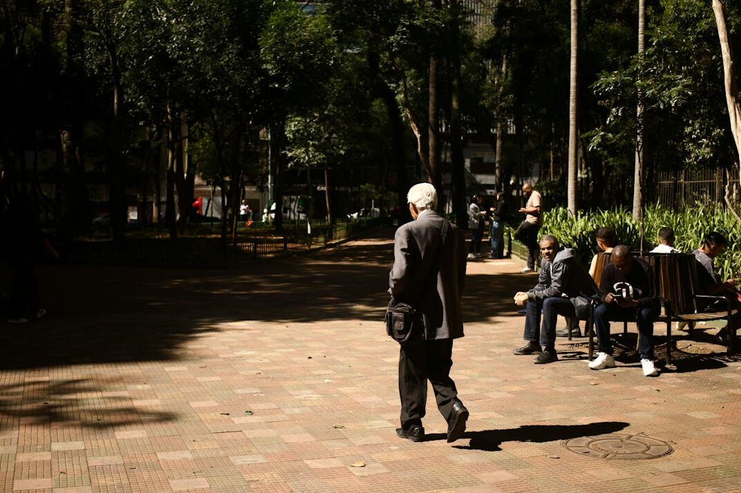 elderly people walking in park