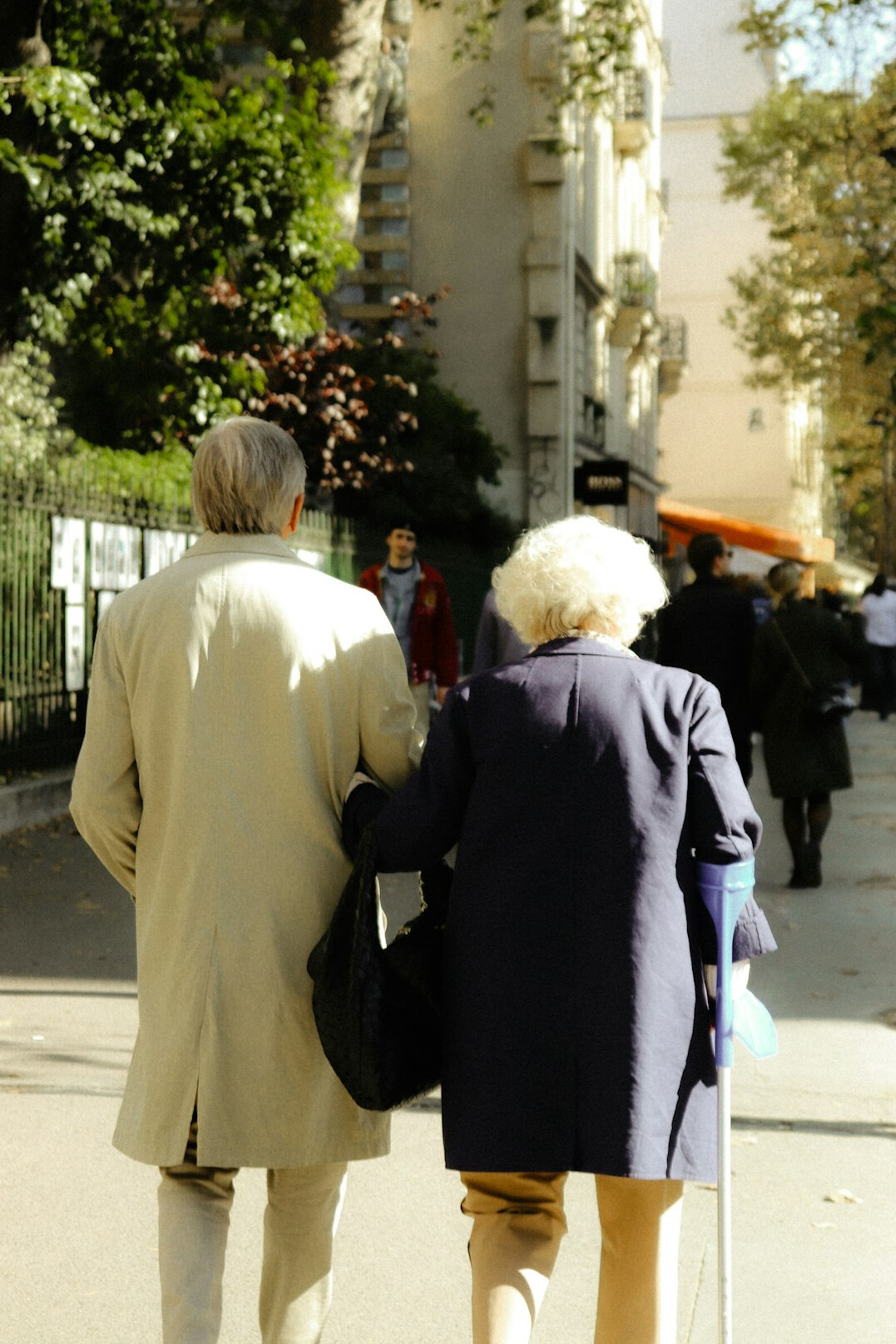 Group of elderly Swiss friends on a neighborhood walk outdoors