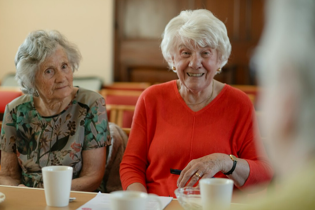 elderly friends talking