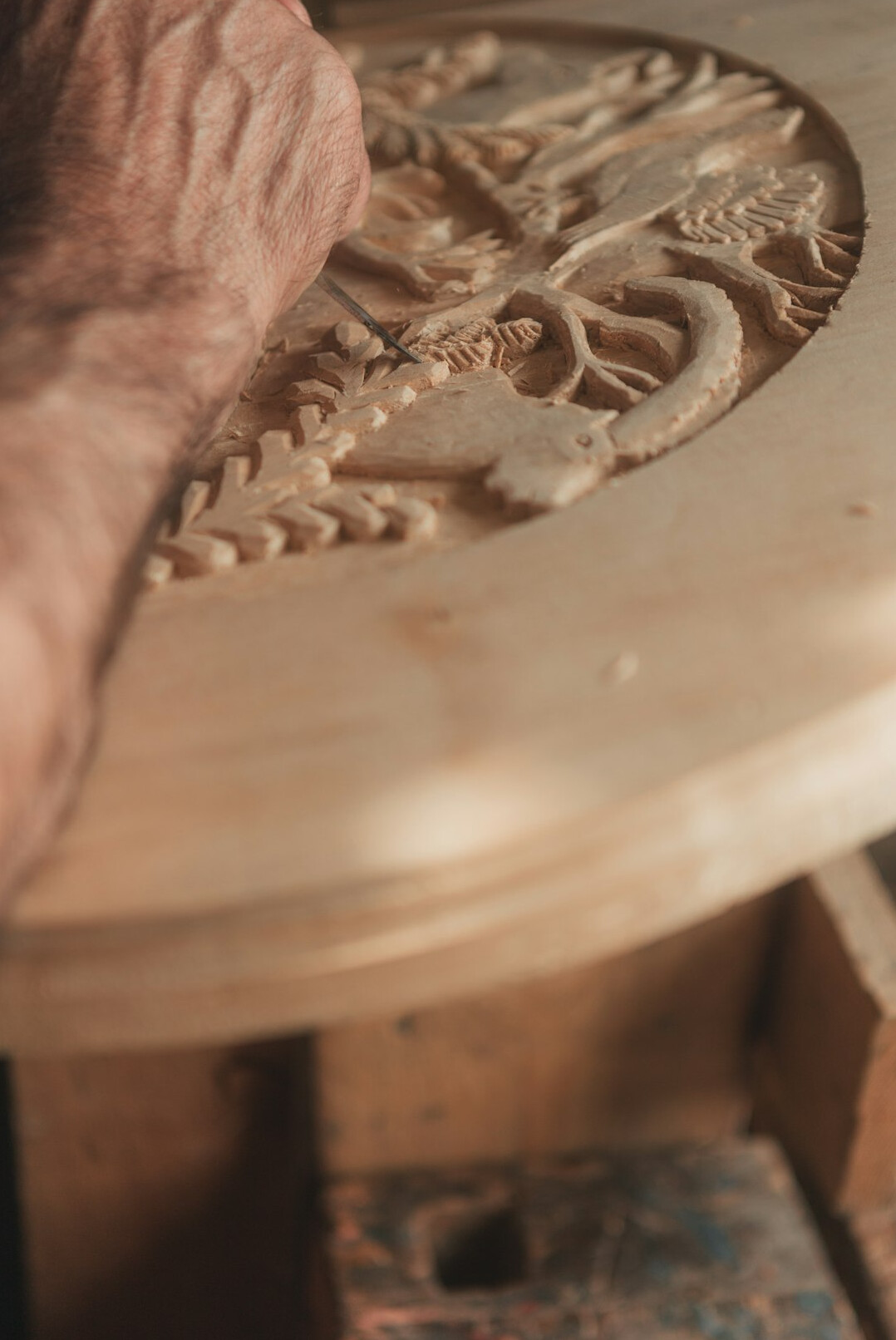 Elderly Swiss woman teaching a handicrafts workshop to a small group